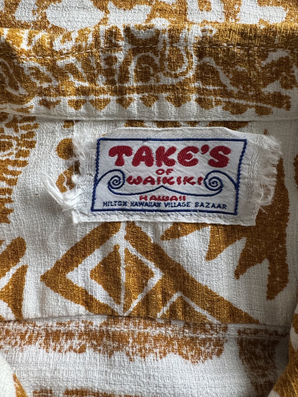 1960s Take’s of Waikiki Hawaiian Shirt – Red & White Polynesian Tapa Print (L)