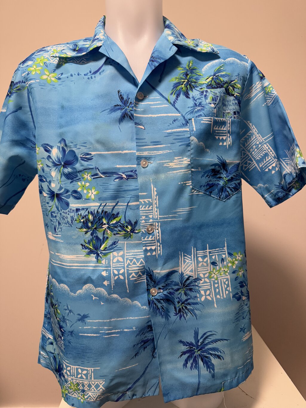 1970s Sears Hawaii Blue Poly Shirt With Huts Hibiscus Palm Cluste 1970s-sears-hawaii-blue-poly-shirt-with-huts-hibiscus-palm-cluste